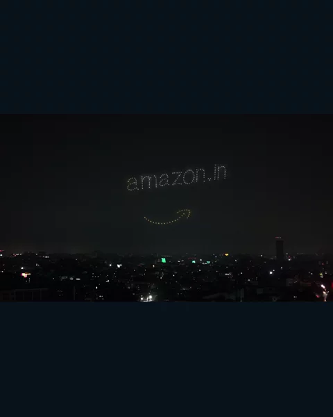 The Amazon logo written in drone lights