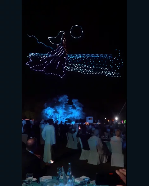 An illuminated drone formation at the Vistal by Victoria Swarovski launch