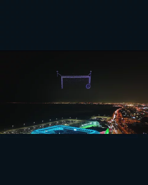 A football goal and ball formed by drones above the Kuwait coast