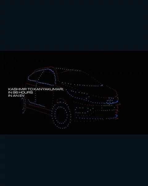 A car outlined in coloured drone lights at the Tata Motors show